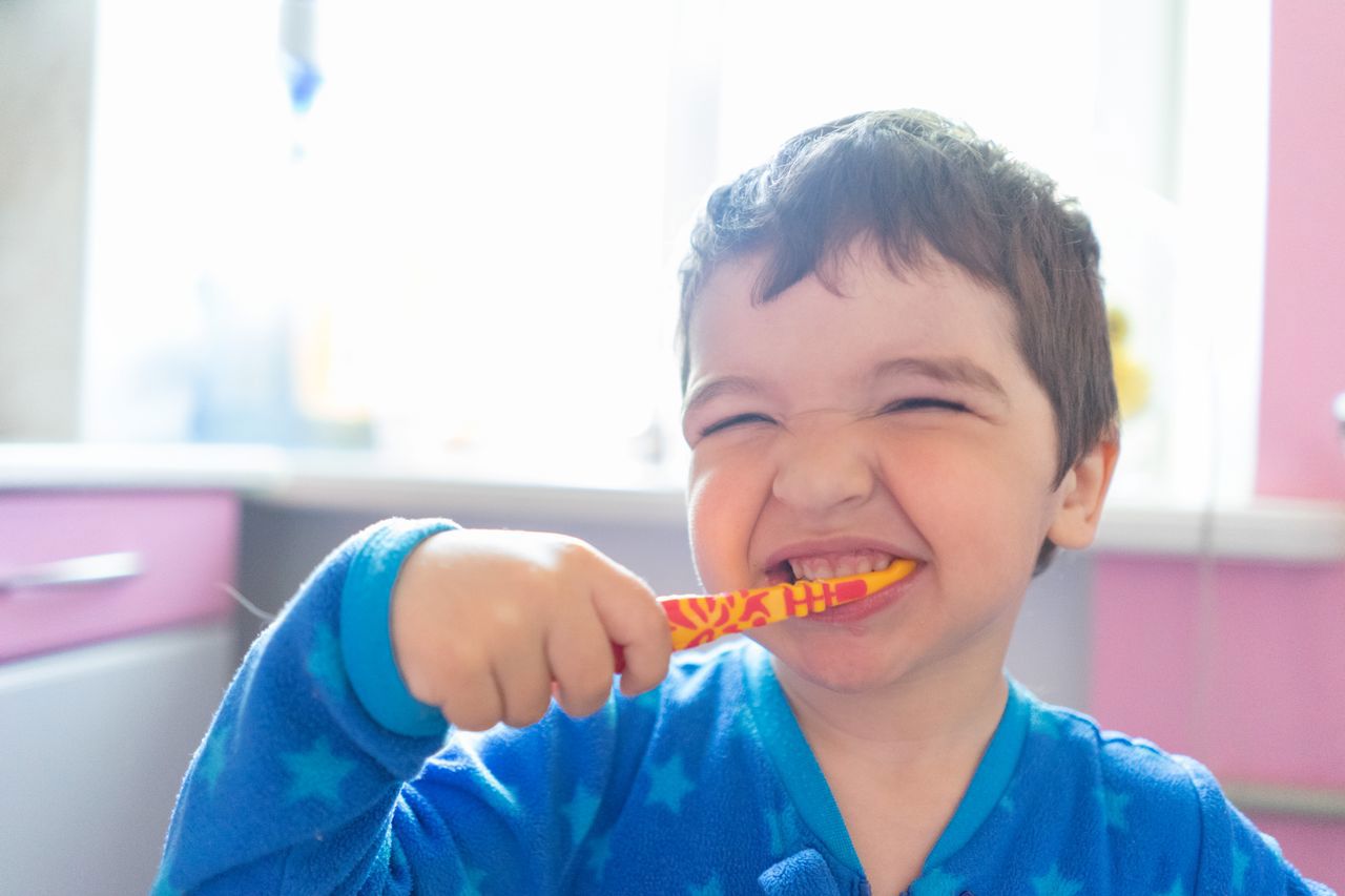 Young boy cleaning his teeth